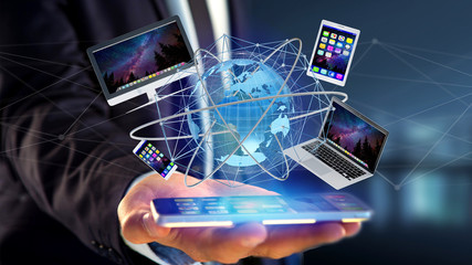 Poster - View of a Businessman holding a Computer and devices displayed on a smartphone interface with international network  - 3d render