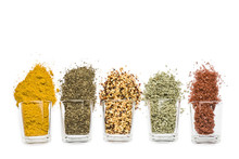 Glass Jars With Various Spices On White Background With Copy Space