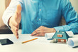 © ronstik - architect real estate agent offering partnership to customer in office