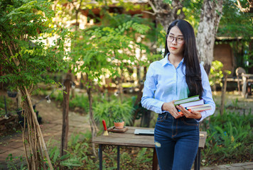 Sticker - portrait woman with a book in garden