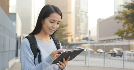 Sticker - Asian woman using tablet computer at outdoor