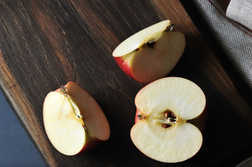 Wall Mural - fresh juicy Apple sliced on a wooden Board