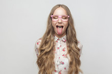 Happy And Crazy Concept. Teenager Girl Closed Eyes And Showing Tongue At Camera.