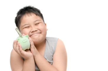 Wall Mural - Obese boy holding piggy bank on hand isolated on white background,