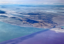 
    The Great Salt Lake, Utah - A Causeway Divides The Northern From The Southern Part Of The Lake. The Northern Part Is More Saline And Has Bacteria That Turn The Water A Pinkish Purple Color.