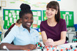 © highwaystarz - Portrait Of Female Pupil And Teacher Using Molecular Model Kit In Science Lesson
