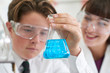 © highwaystarz - Male Pupil And Teacher Conducting Chemistry Experiment