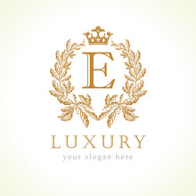 Luxury E Letter And Crown Monogram Logo. Laurel Elegant Beautiful Round Identity With Crown And Wreath. Vector Letter Emblem E For Antique, Restaurant, Cafe, Boutique, Hotel, Heraldic, Jewelry