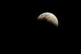 Fototapeta Tęcza - Lunar eclipse, beautiful moon in dark night, Thailand.