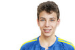 © Мар'ян Філь - Portrait of a young guy in a blue T-shirt on a white background. He has braces on his teeth. Isolated