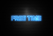 Free Time neon Sign on brickwall