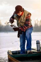 Winter season-elderly man fishing