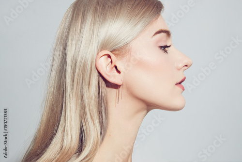 Close Up Portrait Of A Beautiful Young Woman With Long Golden
