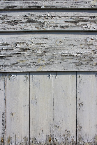 Fotografia, Obraz Paint peeled old wooden siding near the seashore