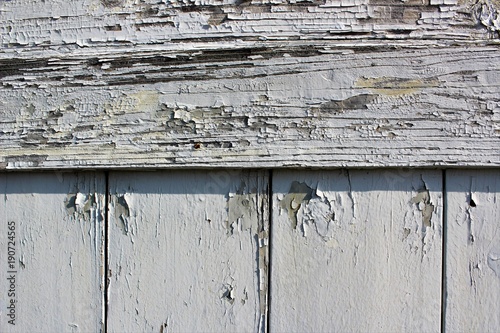 Fotografia, Obraz Paint peeled old wooden siding near the seashore