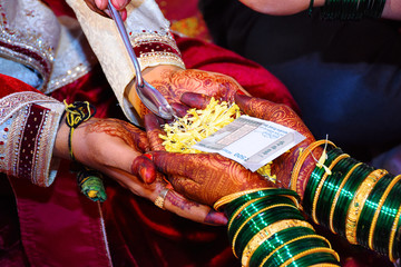 Wall Mural - Bride and groom at Haldi ceremony a couple days before a Hindu wedding