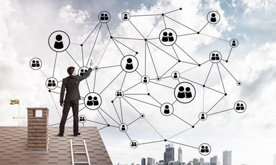 businessman on house roof presenting networking and connection c
