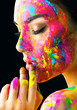© Subbotina Anna - Beauty model girl with colorful paint on her face. Portrait of beautiful woman with flowing liquid paint isolated on black