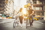 Fototapeta  - couple of new yorkers on their bikes