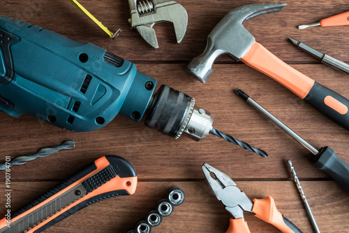 Fotomural Set of work tools on wooden background