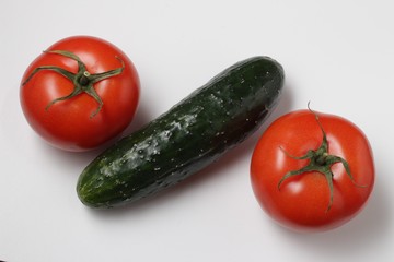 Poster - Cucumbers and tomatoes on white background