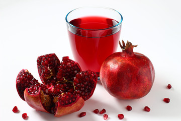 Wall Mural - Pomegranate and pomegranate juice on white background