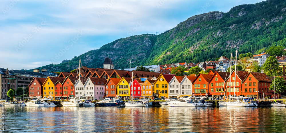 Bergen, Norway. View of historical buildings in Bryggen- Hanseatic wharf in Bergen, Norway. UNESCO World Heritage Site - obrazy, fototapety, plakaty 