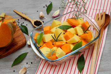 Vegetarian food. Diet food. Vegan food. Preparation pumpkin with potato on the oven.