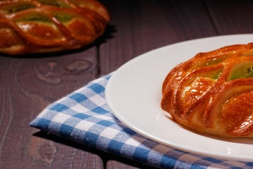 Wall Mural - Bun with kiwi jam on white plate