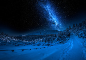 Wall Mural - mountain path in mountains in winter with stars