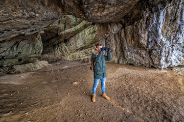 Wall Mural - Man traveling with backpack hiking in mountains