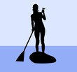 Silhouette of a female standup paddler