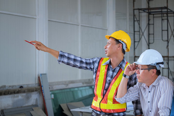 Wall Mural - Engineers are meeting, working and looking at point up in the work place to discuss.Engineering tools and construction concept.