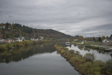 Detail of Moselle river valley with typical village houses near Trier in rainy day in November, Germany. Dark autumn landscape.