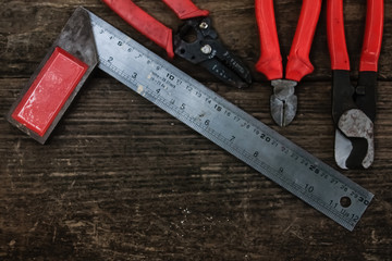 Pliers old craftsman tool on wooden table, vintage  style