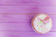 © mikitiger - biscuit cake on a pink wooden background