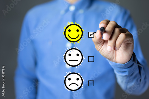 Fotografía Businessman hand putting check mark a checkbox on excellent smiley face rating for a satisfaction survey, Customer experience concept