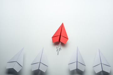 red paper plane leader concept