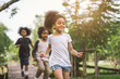 Cute african american little girl playing outdoor - Black people kid and friend happy.