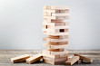 Wooden block tower game on grey table