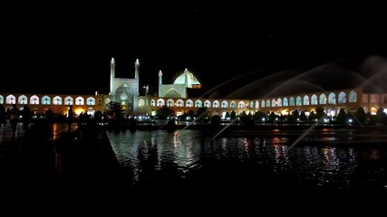 Canvas Print - The dark evening in Isfahan - the fountains in Naqsh-e Jahan square create nice atmosphere for a walk, enjoying the view on medieval architecture - Grand Bazaar gallery and Shah's Mosque, Iran.