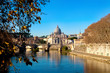 Beautiful view of St. Peter's Basilica in the Vatican from the Tiber River in Rome Italy in the fall.