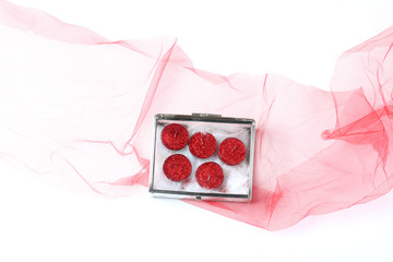 Wall Mural - red veil and box with candles in glitter. flat lay top view, minimal concept