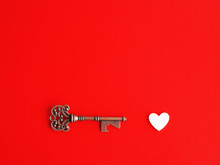 Key To Your Heart, Valentine's Day Concept, Vintage Key And White Heart On A Vivid Red Background, Eternal Love, Negative Space For Text