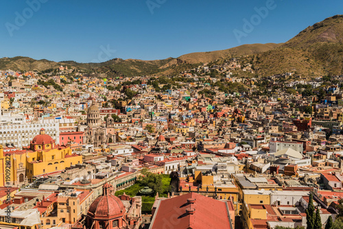 Fotografie, Obraz Looking down on a UNESCO Heritage Site-Guanajuato City, Mexico, from up on a hil