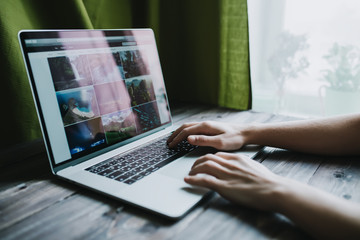 Fototapete - Man freelancer is working using laptop computer at home office. Freelance lifestyle workplace