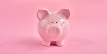 Pink Piggy Bank Over Pink Background