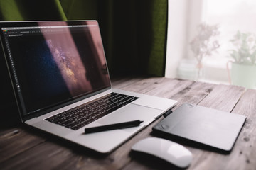 Fototapete - Laptop computer, graphics tablet and mouse at home office. Freelance lifestyle workplace