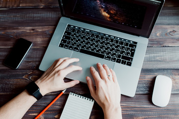 Fototapete - Man designer is working using laptop computer and graphics tablet at home office. Professional occupation workplace
