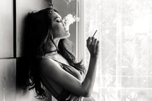 Fashion Portrait Of  Beautiful Woman Sexy Slim Body Smoking Cigarette